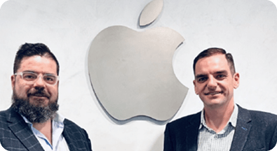 Business professionals at Apple headquarters showcasing tech partnership and collaboration in innovation